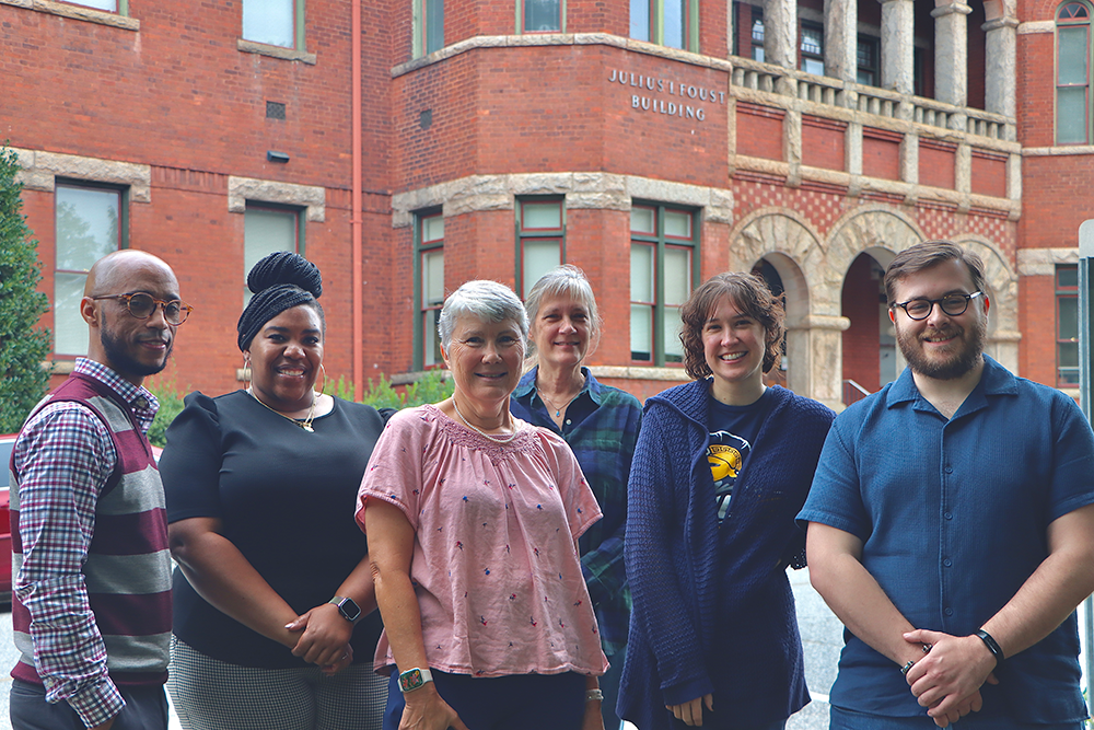 CASA advisors in front of the Foust Building, L-R: Calvin Lowery, Ashley Tuck, Nancy Bucknall, Eleanor Cowen, Caitlin Saraphis, and Ryan Ridpath.